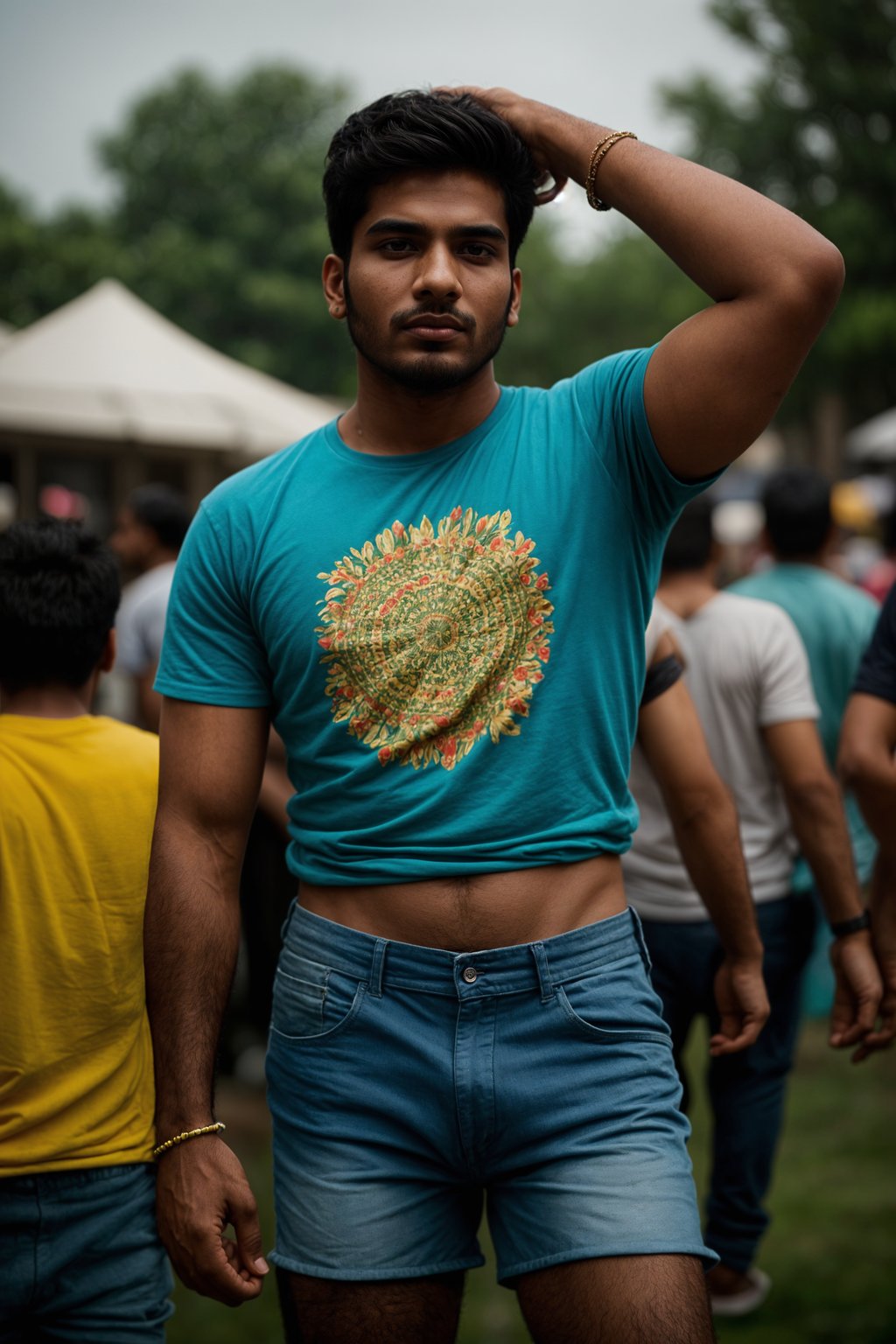 a stunning man as a festival-goer, dancing and enjoying the music in a vibrant crowd, wearing  a colorful graphic t-shirt and denim shorts