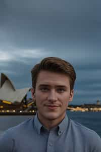 smiling man in Sydney with the Sydney Opera House in the background