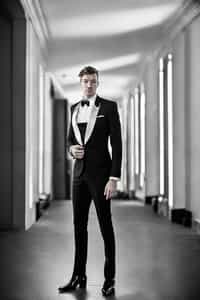 an alluring ifgender=m{masculine} ifgender=f{feminine} man dressed in elegant evening wear, ready for a night out on the town