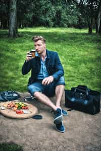 masculine  man having a fun outdoor picnic
