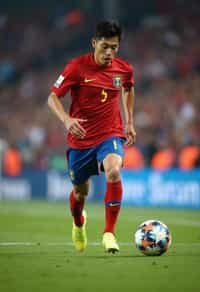 man as Football Player in the FIFA World Cup playing in a Football Match