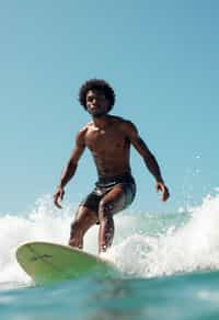 man as a Professional Surfer wearing swimwear on a Surf Board surfing in the ocean