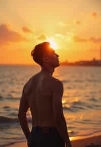 masculine  man enjoying a sunset at a beach or park