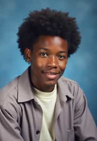 (school portrait) photo headshot of a young 18 y o man in 1990s style, nineties style, 90s, 1990s fashion, 1990s hair, school, man is sitting and posing for a (yearbook) picture, blue yearbook background, official school yearbook photo, man sitting (looking straight into camera), (school shoot), (inside), blue yearbook background