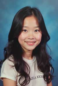 (school portrait) photo headshot of a young 18 y o woman in 1990s style, nineties style, 90s, 1990s fashion, 1990s hair, school, woman is sitting and posing for a (yearbook) picture, blue yearbook background, official school yearbook photo, woman sitting (looking straight into camera), (school shoot), (inside), blue yearbook background