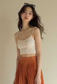 woman wearing crop top and short pleated skirt  in try on fashion shoot for Zara Shein H&M