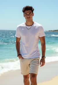 sharp and trendy man in Sydney wearing a summer dress/shorts and t-shirt, Bondi Beach in the background