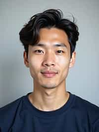 man as official passport photo for government documents. wearing a dark blue navy t-shirt. photorealistic. light gray background. entire face visible. entire head visible