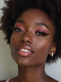 make up ideas for man. fake eyelashes, perfect cat eyeliner, light pink lipstick