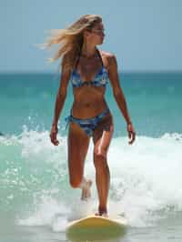 woman as a Professional Surfer wearing swimwear on a Surf Board surfing in the ocean