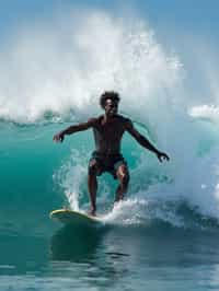 man as individual surfing a massive wave in a clear, blue ocean