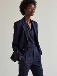 woman wearing navy colopink pants suit  in try on fashion shoot for Zara Shein H&M