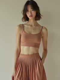 woman wearing crop top and short pleated skirt  in try on fashion shoot for Zara Shein H&M