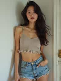 woman wearing crop top and denim shorts  in try on fashion shoot for Zara Shein H&M