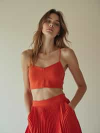 woman wearing crop top and short pleated skirt  in try on fashion shoot for Zara Shein H&M