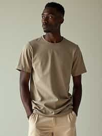 man wearing  t-shirt and pants in try on fashion shoot for Zara Shein H&M