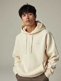 man wearing  cream hoodie in try on fashion shoot for Zara Shein H&M